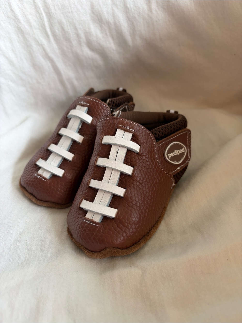 pediped Brown Football-Style Baby Moccasins with White Laces
